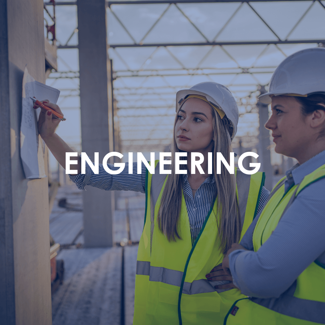 Industrial Recruitment - Two female engineers in hard hats looking at a plan