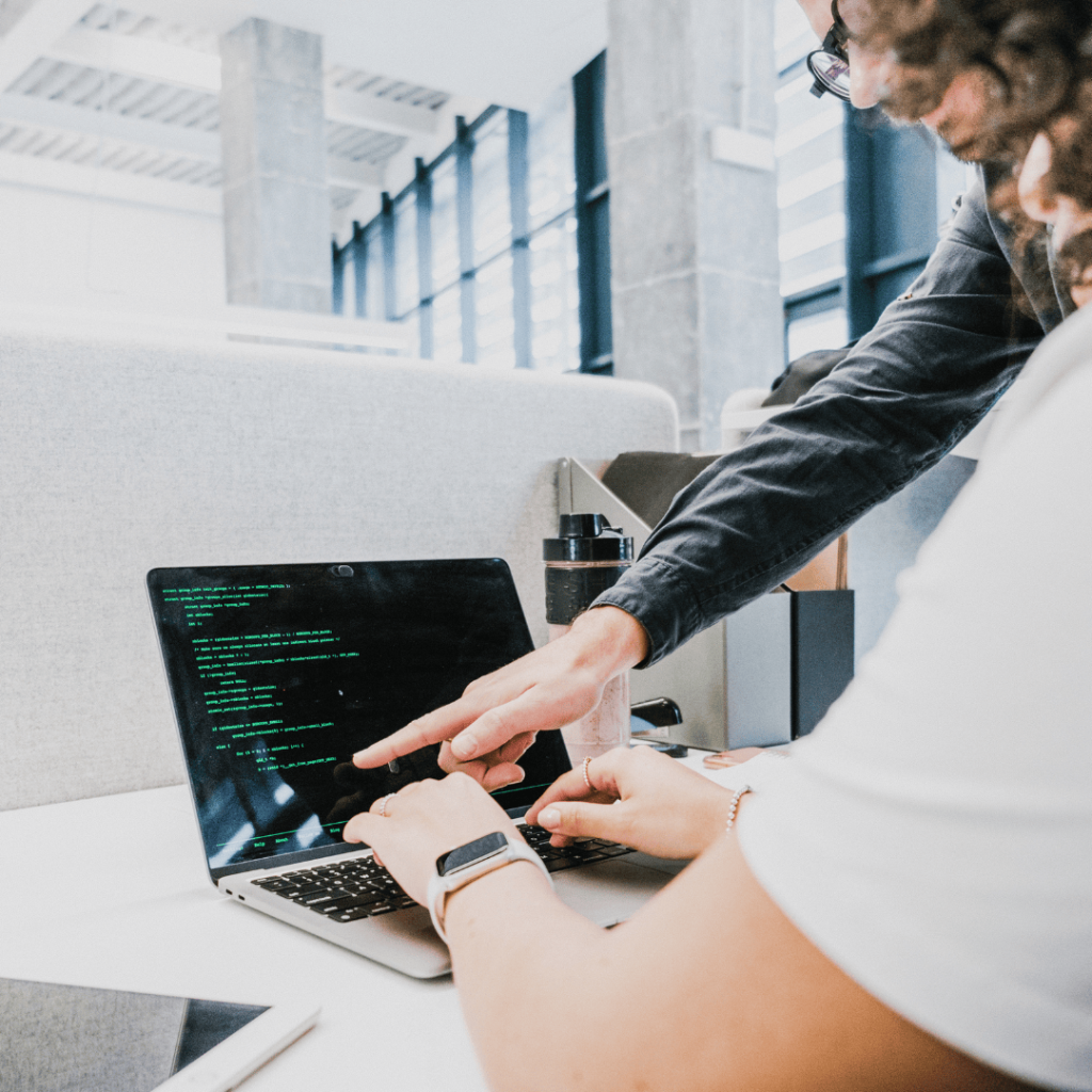 NI Increase: people pointing at a laptop screen