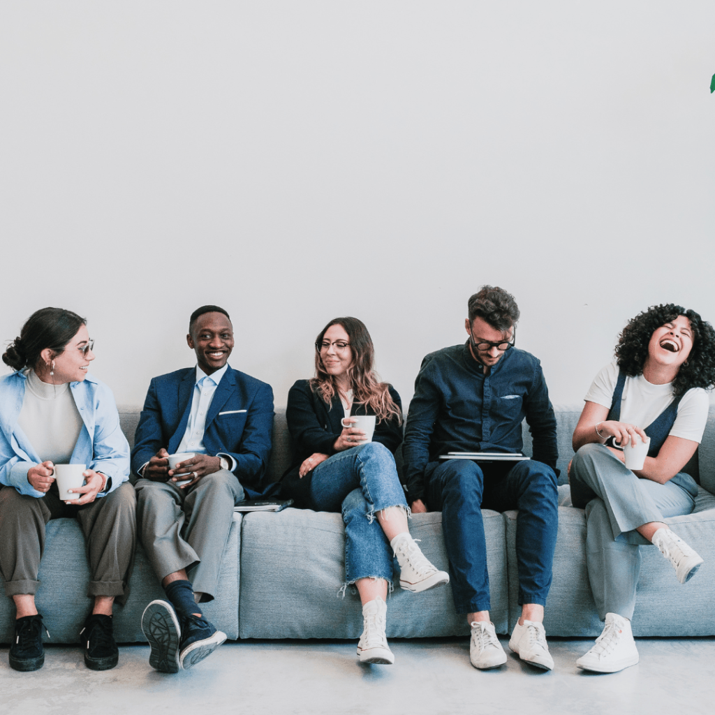 NI I~ncrease: row of professiopnal people sat on a sofa